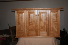 Load image into Gallery viewer, Shaker style flat screen television cabinet hanging Adirondack cherry  bi fold doors raised panels