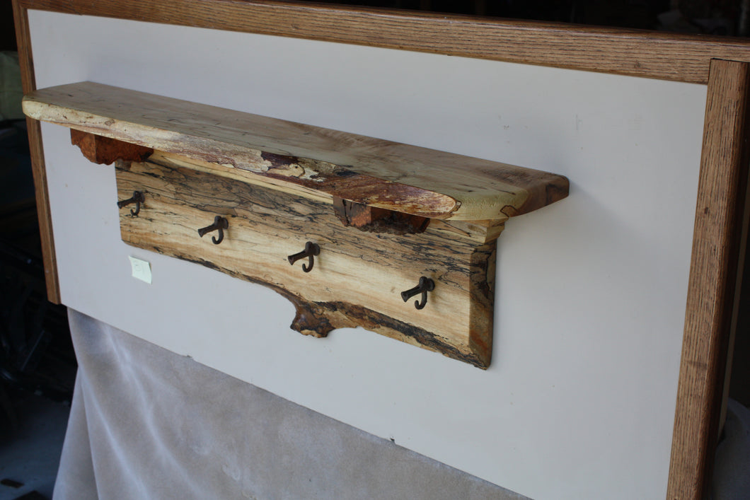 wall shelf with four antique cast iron maple syrup taps live edge crown molding burl shelf supports  spalted maple