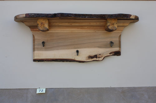 wall shelf  brown maple with three antique cast iron maple syrup taps live edge crown molding log shelf supports