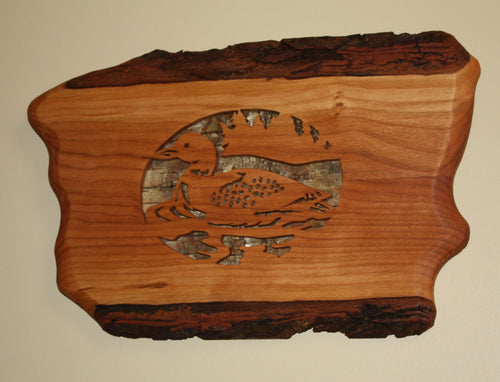 scroll saw loon on mountain lake live edge cherry birch bark backing displayed on wall